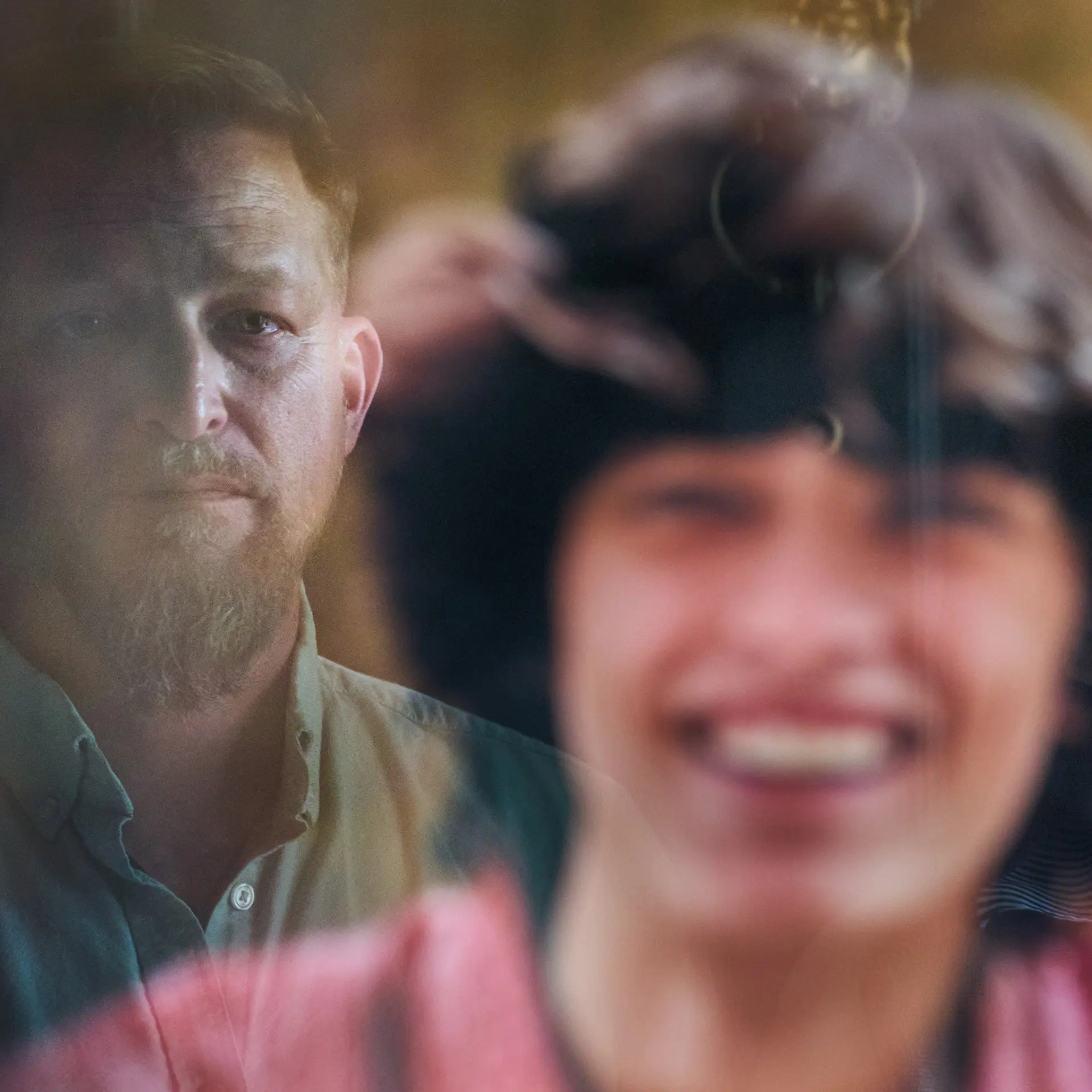 Brandon Guffey looking at a photo of Gavin Guffey.