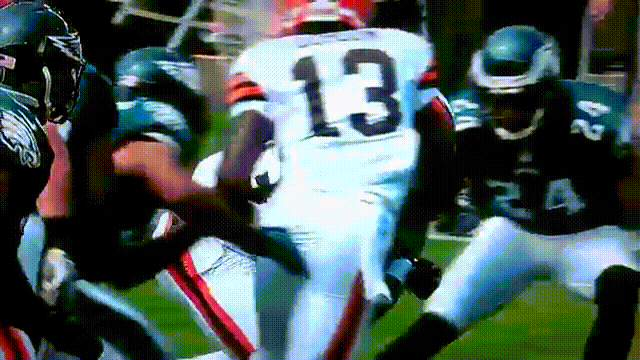 Cleveland Browns running back Trent Richardson runs over Philadelphia Eagles safety Kurt Coleman and causes his helmet to fly off during an NFL football game on Sunday, September 9, 2012.
